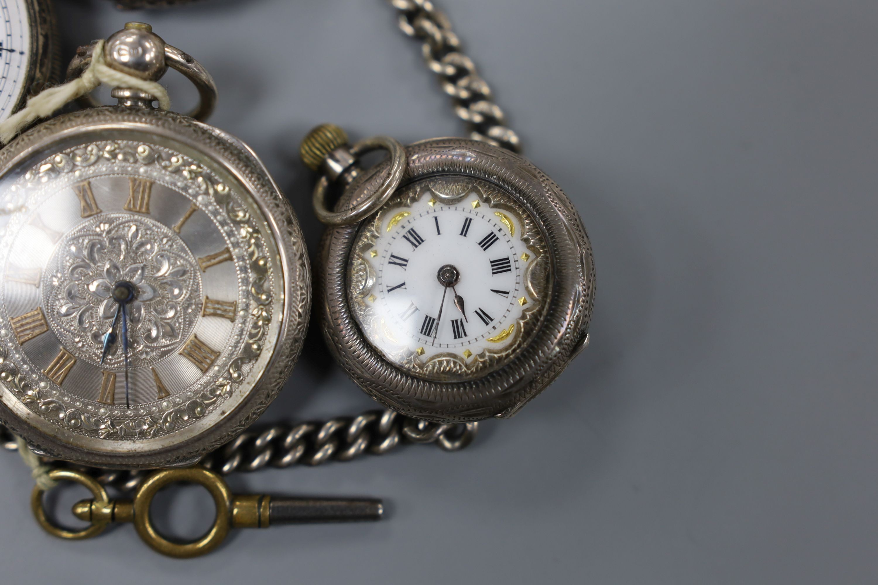 Four assorted late 19th century silver or white metal fob watches including two with case.